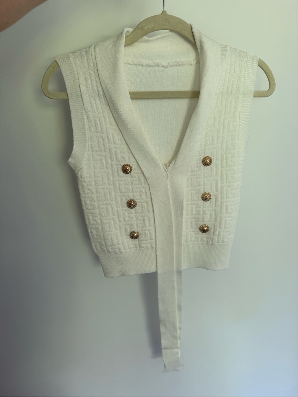 White pattern top with gold buttons